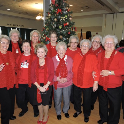 Generous Group of Ladies Spreading Cheer around the tree