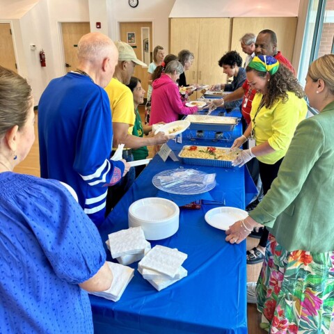 Members enjoying the buffet at our Cultural Celebration of Brazil